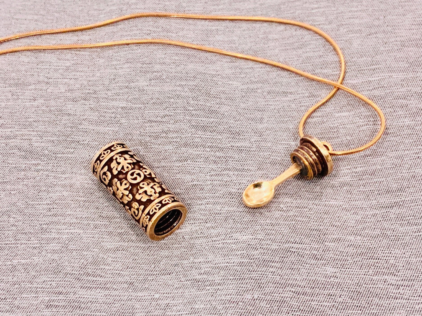 Gold cylindrical cylinder pendant amulet openable hollow capsule with mini spoon and storage for medicine powder sand liquid aromatherapy oils unique crafty thrifty special high quality handmade